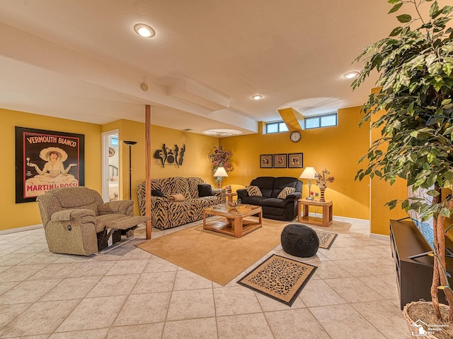 living room featuring baseboards and recessed lighting