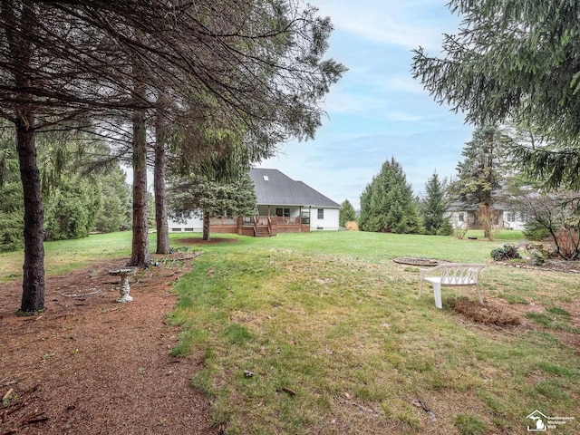 view of yard with a wooden deck