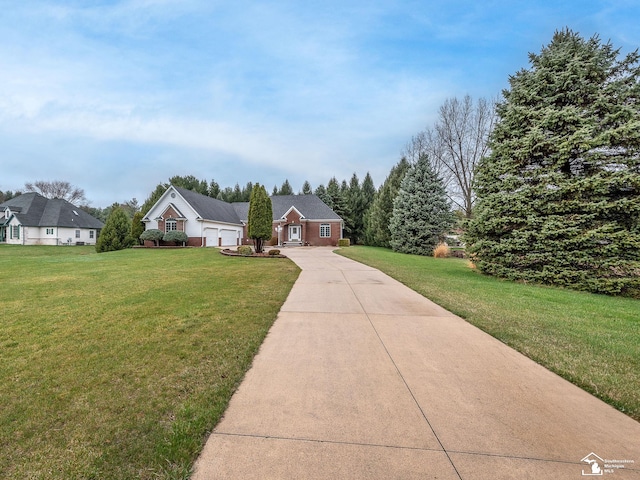view of front of house with a front yard and concrete driveway
