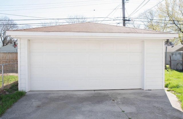detached garage with fence