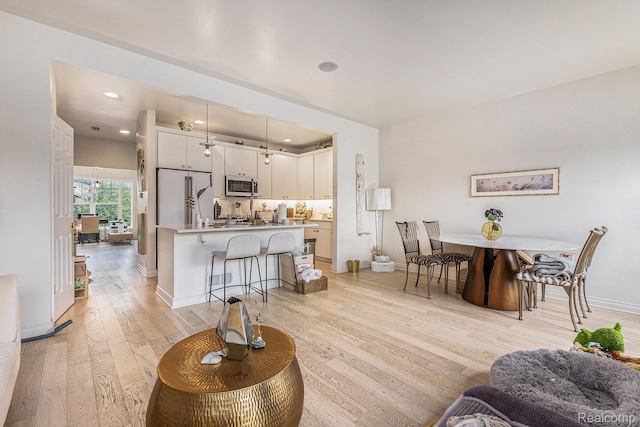 4311 Miracles Blvd Unit 22, Detroit, MI 48201 - living area with light wood-type flooring, baseboards, and recessed lighting