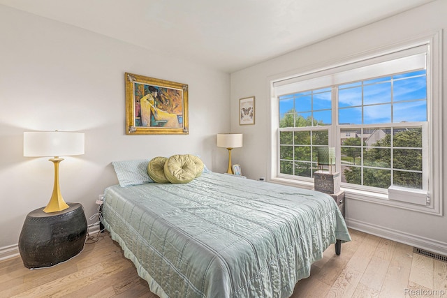 4311 Miracles Blvd Unit 22, Detroit, MI 48201 - bedroom with baseboards and wood-type flooring