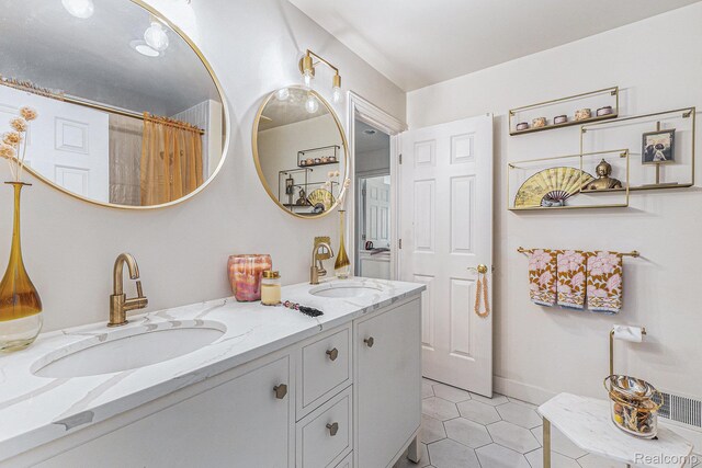 4311 Miracles Blvd Unit 22, Detroit, MI 48201 - bathroom featuring double vanity, tile patterned flooring, and a shower with shower curtain