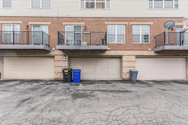4311 Miracles Blvd Unit 22, Detroit, MI 48201 - rear view of house featuring an attached garage and brick siding