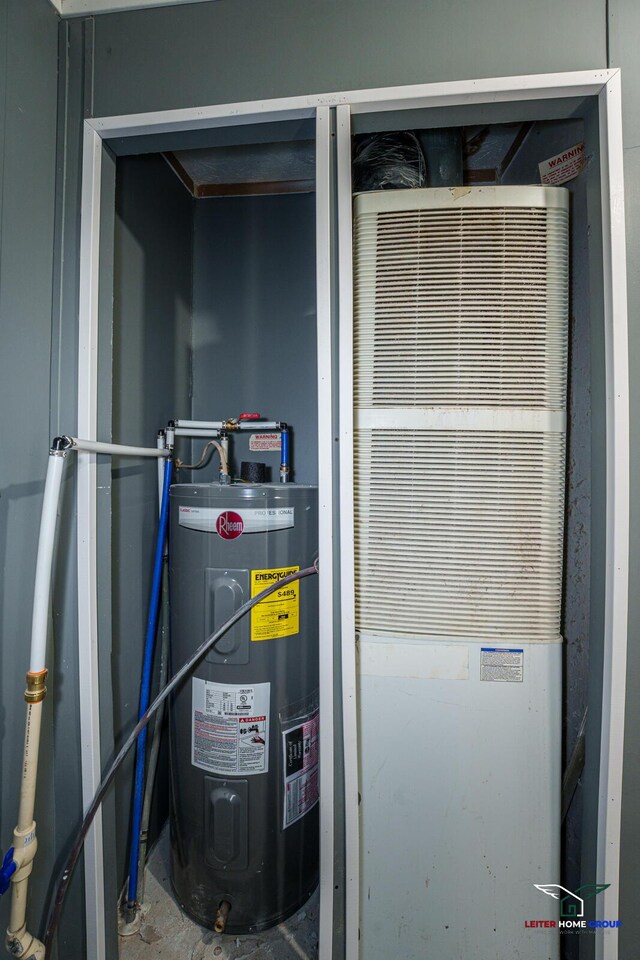 utility room featuring a heating unit and water heater