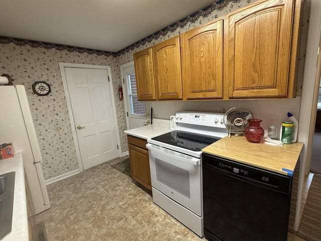 kitchen featuring brown cabinets, wallpapered walls, light floors, light countertops, and white appliances
