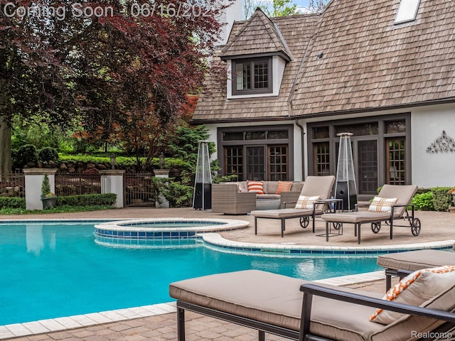 2010 W Valley Rd, Bloomfield Hills, MI 48304 - view of pool featuring an outdoor structure, a storage structure, a pool with connected hot tub, a patio area, and an outdoor living space