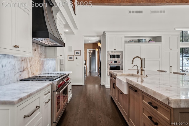 2010 W Valley Rd, Bloomfield Hills, MI 48304 - kitchen with stainless steel appliances, custom exhaust hood, open shelves, backsplash, and dark wood-type flooring