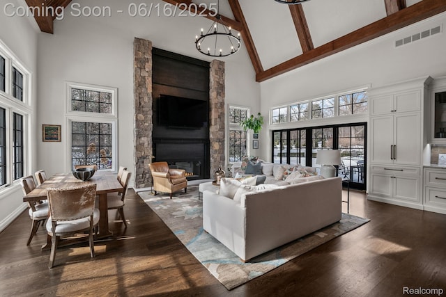 2010 W Valley Rd, Bloomfield Hills, MI 48304 - living room featuring high vaulted ceiling, a stone fireplace, dark wood-style flooring, a chandelier, and beam ceiling