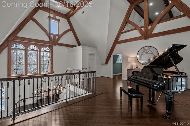 2010 W Valley Rd, Bloomfield Hills, MI 48304 - living area with high vaulted ceiling, an upstairs landing, healthy amount of natural light, wood finished floors, and beamed ceiling