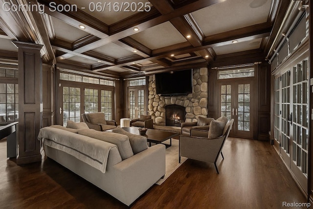 2010 W Valley Rd, Bloomfield Hills, MI 48304 - living area featuring beam ceiling, dark wood-type flooring, a stone fireplace, french doors, and plenty of natural light