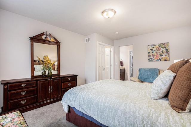 bedroom with carpet floors and visible vents