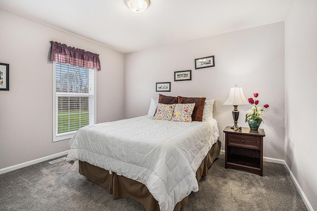 carpeted bedroom featuring visible vents and baseboards
