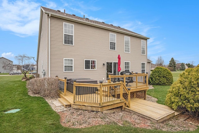 back of property featuring a yard and a deck