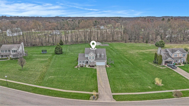 bird's eye view featuring a wooded view