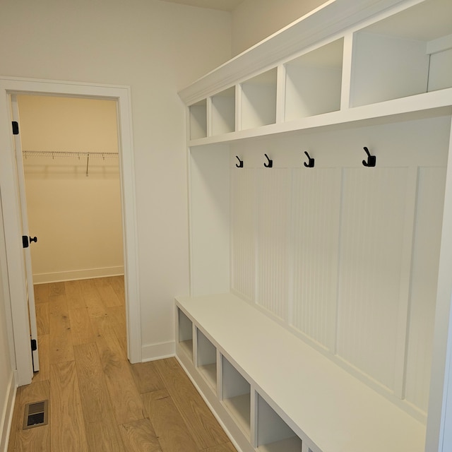 50638 Mistwood Dr, Macomb, MI 48042 - mudroom with light wood-style flooring and baseboards