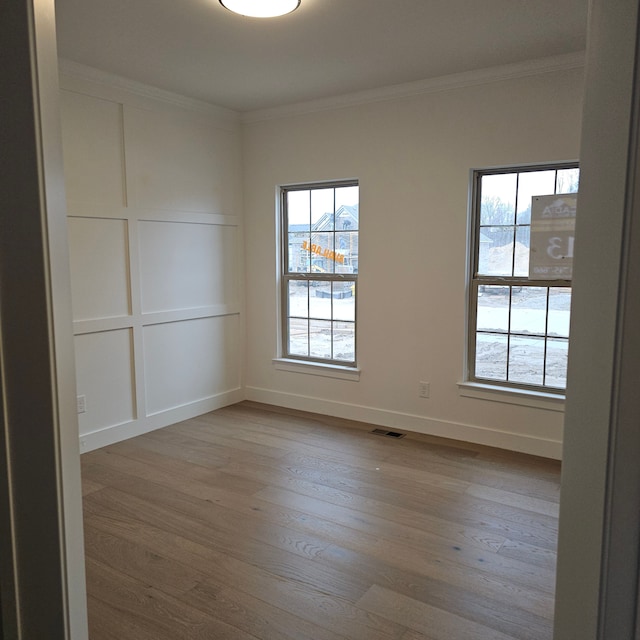 50638 Mistwood Dr, Macomb, MI 48042 - empty room with hardwood / wood-style flooring, crown molding, and baseboards
