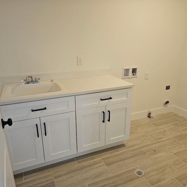 50638 Mistwood Dr, Macomb, MI 48042 - washroom with washer hookup, baseboards, and cabinet space