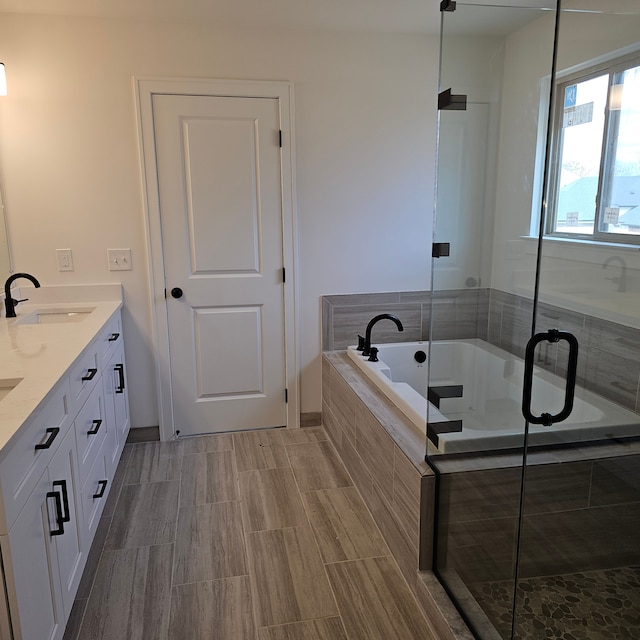 50638 Mistwood Dr, Macomb, MI 48042 - full bathroom with a bath, double vanity, and a shower stall