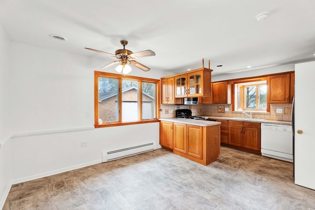 kitchen with brown cabinetry, a baseboard radiator, a peninsula, and dishwasher