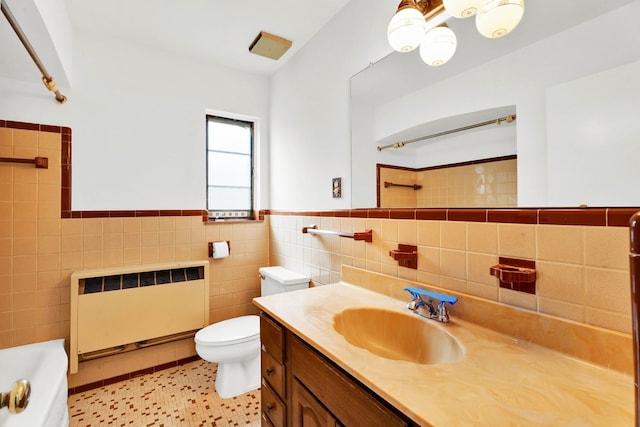full bathroom featuring a bathtub, tile walls, a shower, toilet, and radiator
