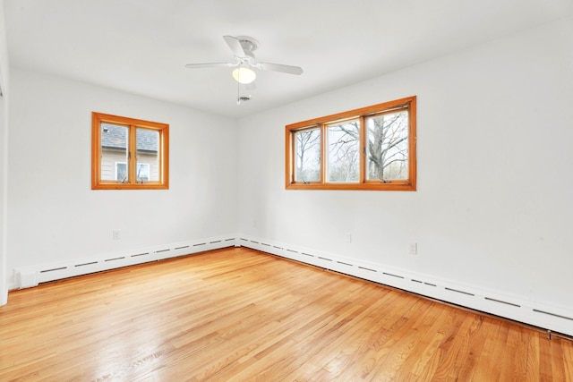 unfurnished room featuring baseboards, ceiling fan, and wood finished floors
