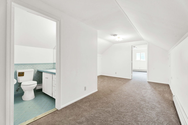 bonus room with carpet flooring, a baseboard heating unit, vaulted ceiling, and a baseboard radiator