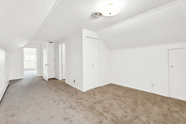 bonus room featuring visible vents, vaulted ceiling, and carpet