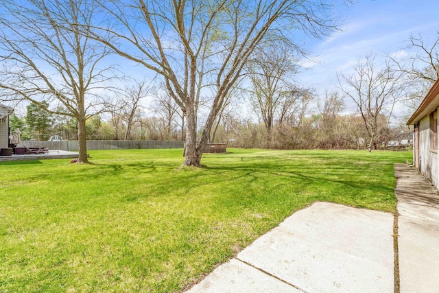 view of yard with fence and a patio