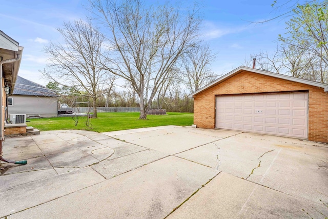 detached garage featuring fence