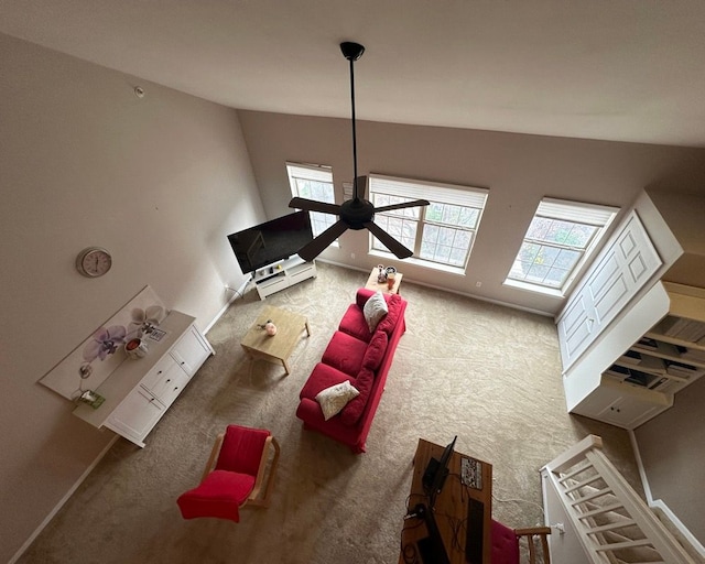 carpeted living area with a healthy amount of sunlight
