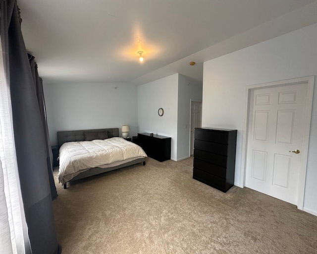 carpeted bedroom with baseboards