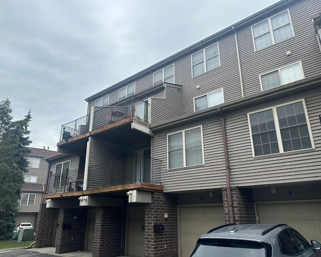 view of building exterior with an attached garage