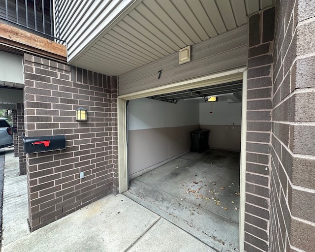 garage featuring a garage door opener and concrete driveway