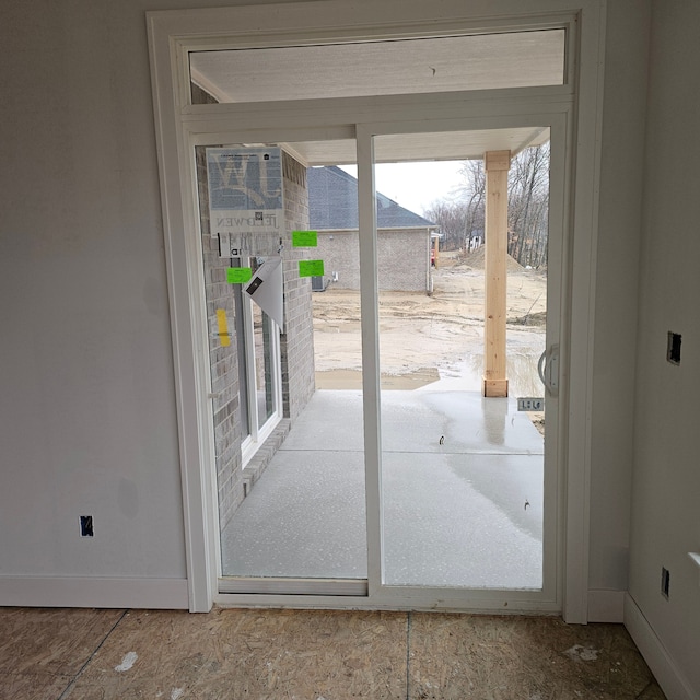 doorway with baseboards