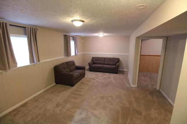 1154 Martin Dr, Frankfort, MI 49635 - carpeted living area with baseboards and a textured ceiling