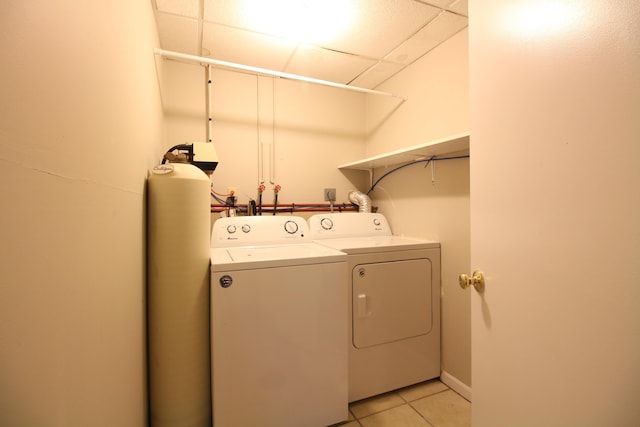 1154 Martin Dr, Frankfort, MI 49635 - clothes washing area featuring light tile patterned flooring, laundry area, and independent washer and dryer