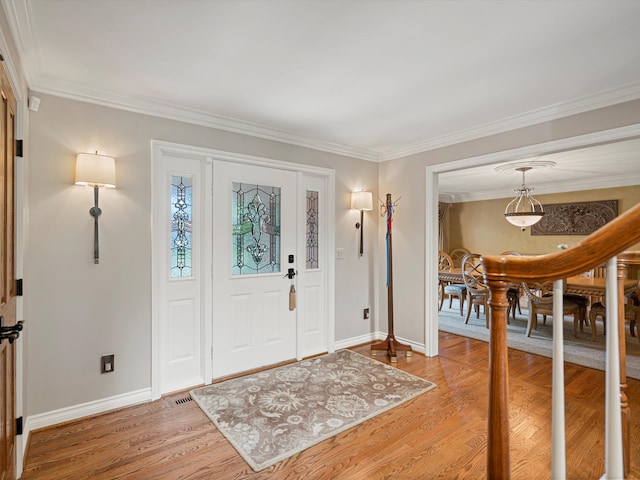 14165 Bournemuth Dr, Shelby Twp, MI 48315 - entrance foyer featuring a chandelier, light wood-style floors, baseboards, and ornamental molding