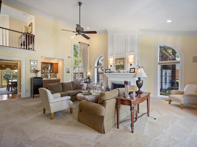14165 Bournemuth Dr, Shelby Twp, MI 48315 - living room featuring light colored carpet, ceiling fan, a wealth of natural light, and crown molding