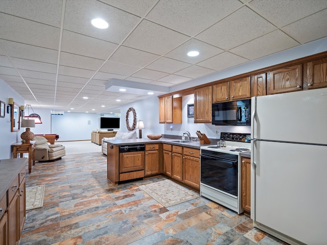 14165 Bournemuth Dr, Shelby Twp, MI 48315 - kitchen with a sink, white appliances, a peninsula, brown cabinetry, and open floor plan