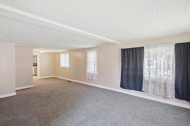 carpeted spare room with baseboards
