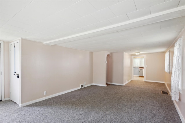 spare room with carpet floors and baseboards