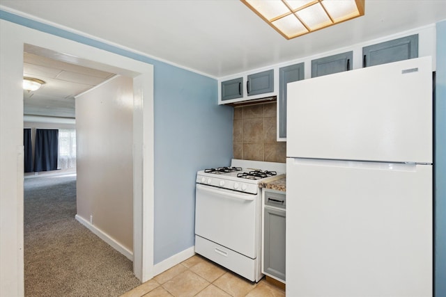 kitchen featuring white appliances, backsplash, baseboards, gray cabinetry, and light tile patterned floors