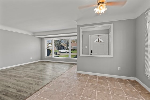 9226 Grandville Ave, Detroit, MI 48228 - tiled foyer with a ceiling fan, baseboards, and ornamental molding