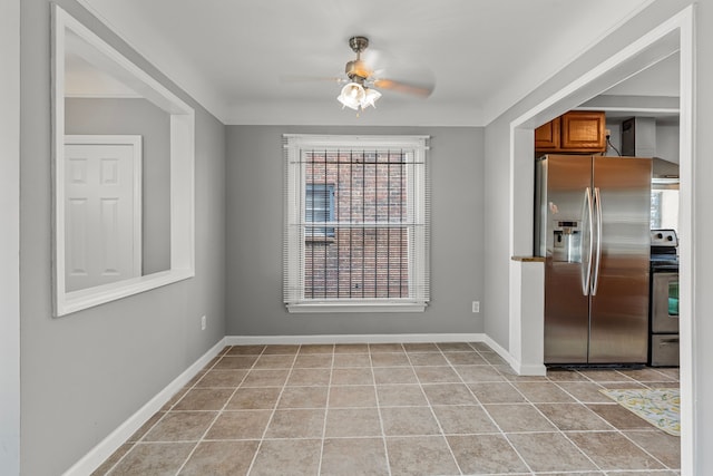 9226 Grandville Ave, Detroit, MI 48228 - unfurnished dining area with light tile patterned floors, baseboards, and ceiling fan