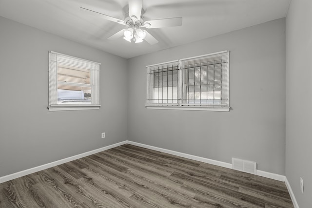 9226 Grandville Ave, Detroit, MI 48228 - spare room featuring baseboards, wood finished floors, visible vents, and ceiling fan