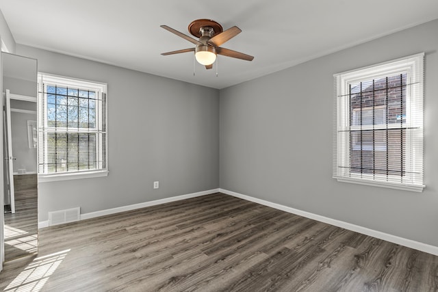 9226 Grandville Ave, Detroit, MI 48228 - empty room with baseboards, wood finished floors, visible vents, and ceiling fan