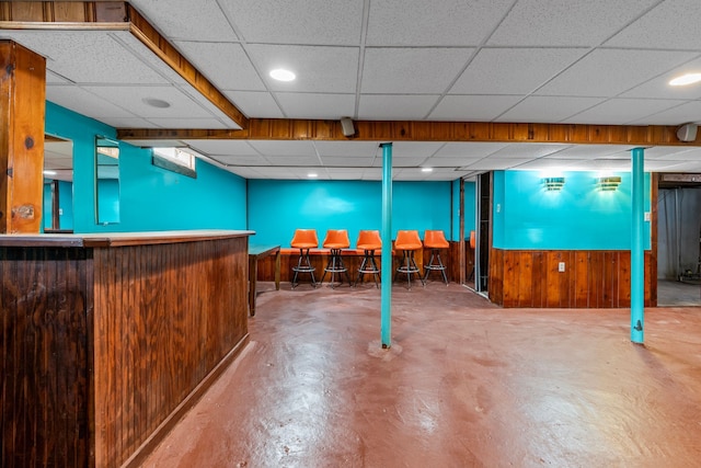 9226 Grandville Ave, Detroit, MI 48228 - finished below grade area featuring a paneled ceiling, wooden walls, and a bar