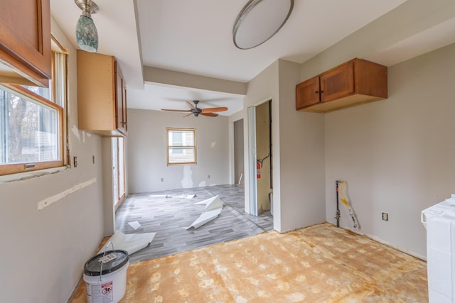 kitchen featuring brown cabinetry and ceiling fan