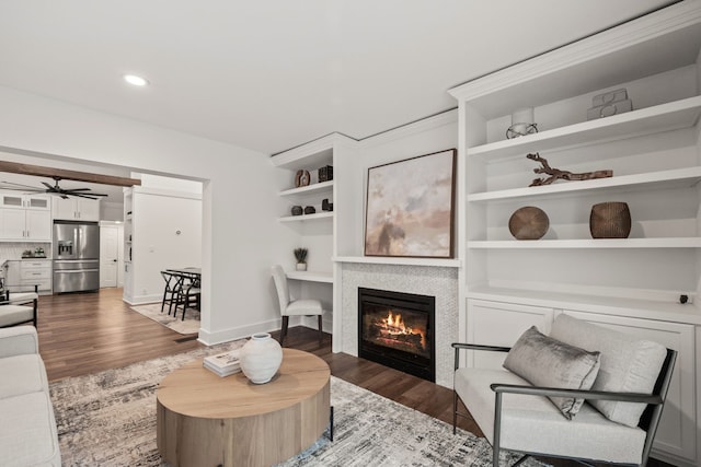 living room with ceiling fan, recessed lighting, wood finished floors, and a fireplace